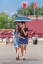 Young fashionable girls on a sunny Tiananmen Square, Beijing, China